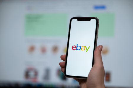 December 3, 2022, Almaty, Kazakhstan: a woman holds a smartphone with an ebay application on the...
