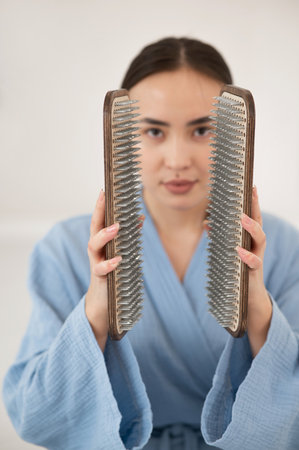 Asian woman holding sadhu boards on face background.の写真素材
