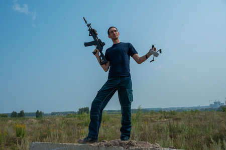 Caucasian man shot down a drone with a shot from a rifle.の写真素材
