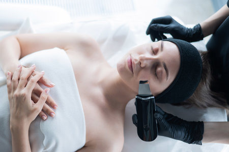 Top view of a woman on an ultrasonic cleaning procedure. Hardware cosmetology.の写真素材