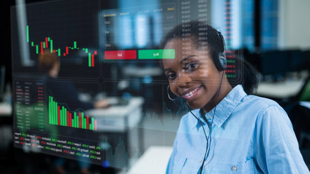 African American woman works as a call center operator.Stock charts. Broker terminal.の写真素材