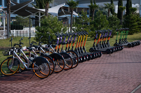 05.02.2022 Sochi, Russia: A range of electric scooters and bicycles for rent outdoors.のeditorial素材