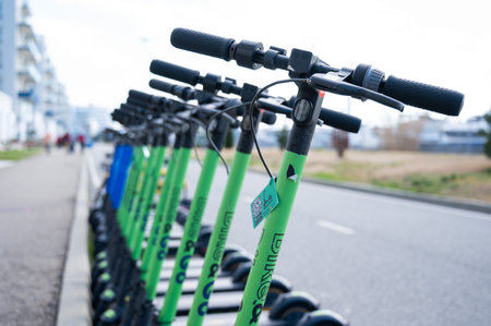 05.02.2022 Sochi, Russia: Row of electric scooters for rent outdoors.のeditorial素材