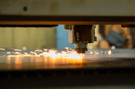 CNC machine. Laser cutting of metal. Sparks.の写真素材