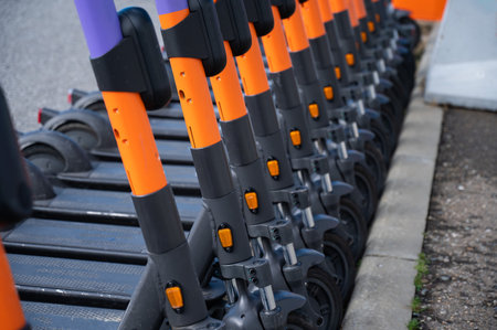 05.02.2022 Sochi, Russia: Row of electric scooters for rent outdoors.のeditorial素材