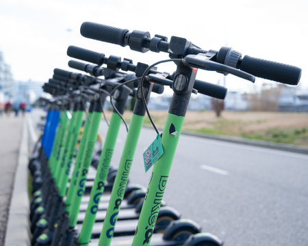 05.02.2022 Sochi, Russia: Row of electric scooters for rent outdoors.のeditorial素材