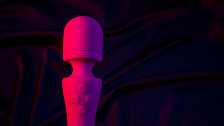 Pink vibrator in neon pink and blue light.の写真素材
