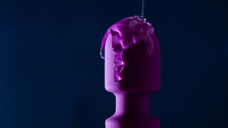 Intimate lubricant pours on a purple vibrator on a blue background. Copy space.の写真素材