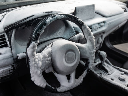 Car interior in a layer of cleaning foamの写真素材