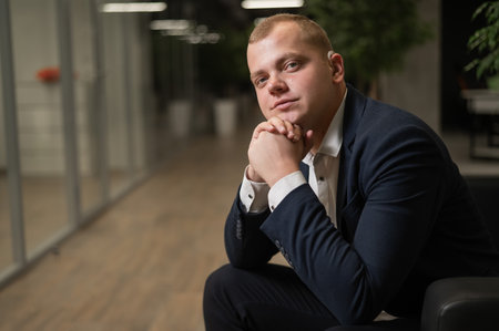 Portrait of a Caucasian man in a suit with a hearing aid