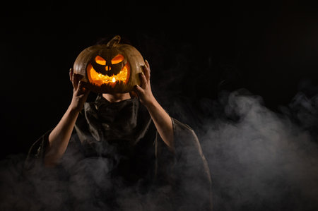 Pumpkin jack o lantern instead of a womans head. Halloween.の写真素材