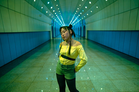 Portrait of an Asian young woman in a subway crossingの写真素材