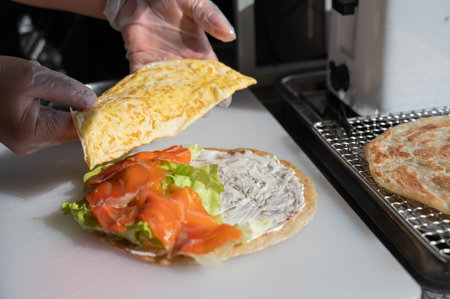 Chef prepares flatbread with salmonQuesadillaの写真素材