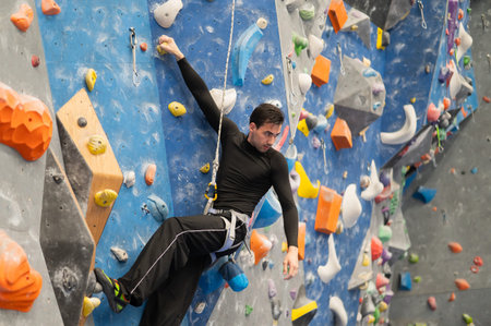 Caucasian man training on a climbing wall