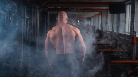 Caucasian bald man posing in the gymの写真素材