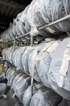 New car tires in plastic bags in a storeの写真素材