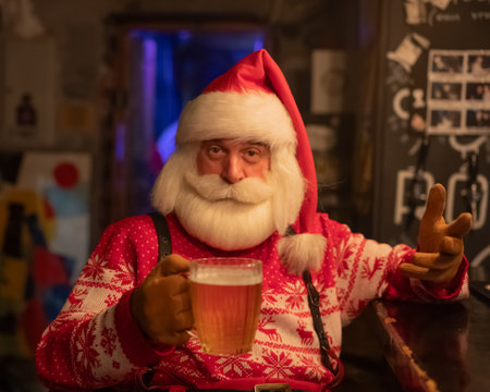 Santa Claus drinking beer at a barの写真素材