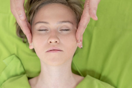 Top view of woman getting facial massageの写真素材