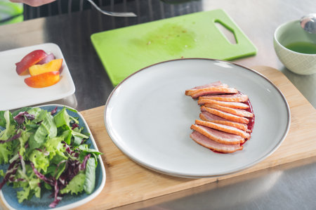 The chef serves roast duckの写真素材