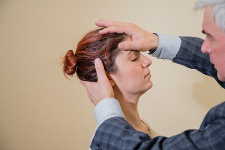 Elderly male hypnotherapist with a female patient. An alternative way to heal mental health.の写真素材