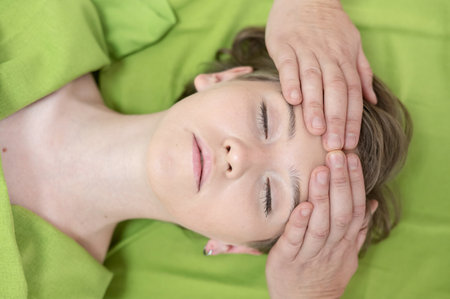 Top view of woman getting facial massageの写真素材