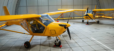 Yellow airplane glider in the hangarの写真素材