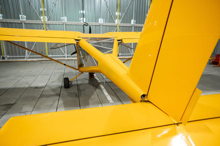 Yellow airplane glider in the hangar