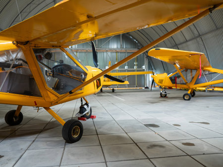 Yellow airplane glider in the hangar