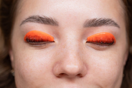 Caucasian woman undergoing eyelash lamination procedure. top viewの写真素材