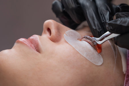 Caucasian woman undergoing eyelash lamination procedureの写真素材