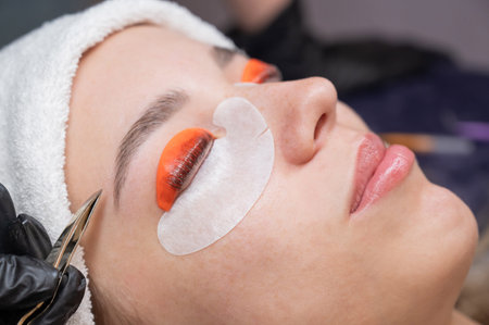 Caucasian woman undergoing eyelash lamination procedure