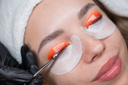 Caucasian woman undergoing eyelash lamination procedure