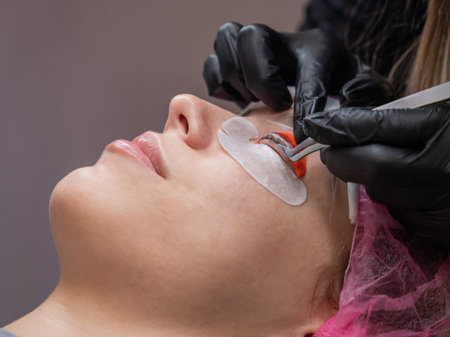 Caucasian woman undergoing eyelash lamination procedure