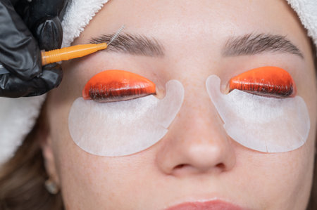 Caucasian woman undergoing eyelash lamination procedureの写真素材