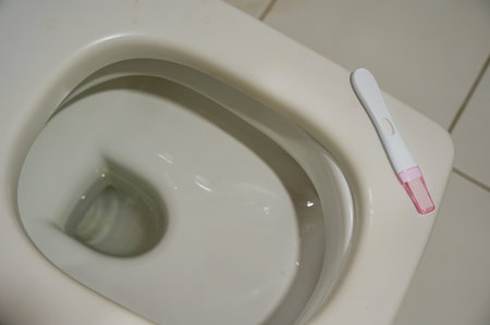 Pregnancy test on the toiletの写真素材