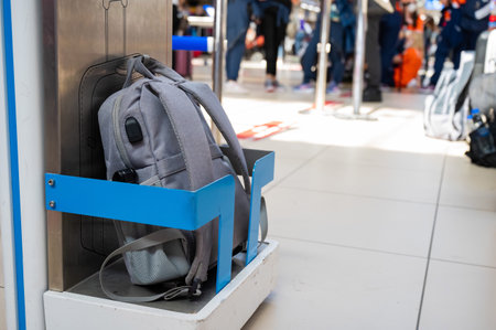 Metal frame control at the airport terminal. Checking the size of hand luggage at the airportの写真素材