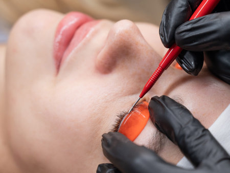 Caucasian woman undergoing eyelash lamination procedure