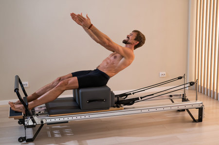 A man doing Pilates on a reformerの写真素材