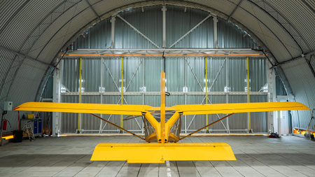 Yellow airplane glider in the hangarの写真素材