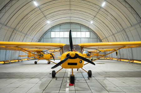 Yellow airplane glider in the hangarの写真素材