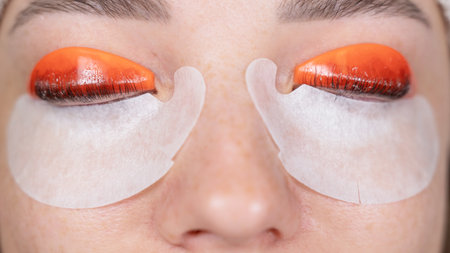 Caucasian woman undergoing eyelash lamination procedure. top viewの写真素材