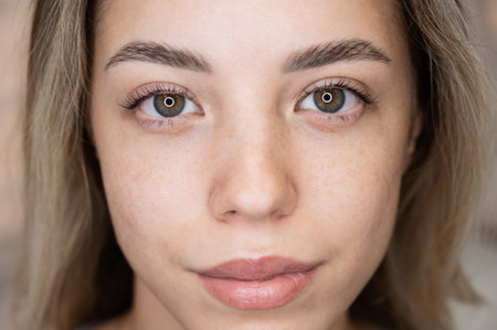 Close-up portrait of a woman after eyelash lamination procedure