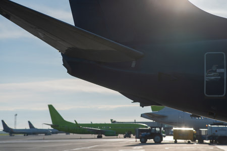 Airplane undergoing repairs in the open airの写真素材