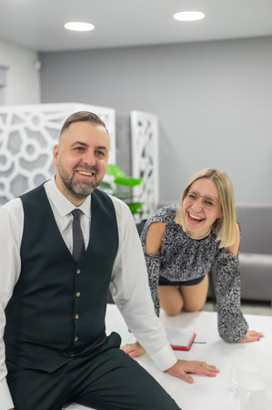 Colleagues fooling around at work in the officeの写真素材