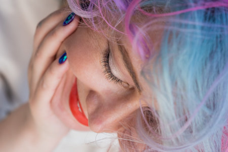 Close-up portrait of Caucasian woman with multi-colored hairstyle
