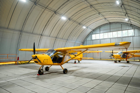 Yellow airplane glider in the hangar