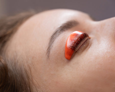 Caucasian woman undergoing eyelash lamination procedureの写真素材
