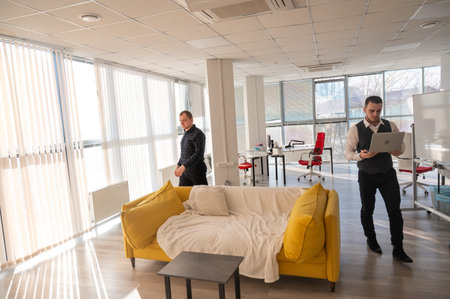 Two Caucasian men in the officeの写真素材