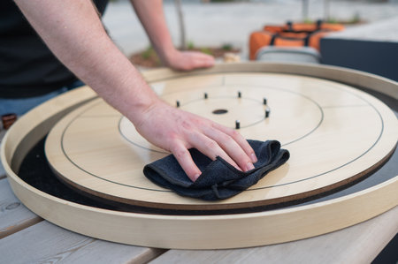Strategic Game Pieces on a Wooden Board crokinoleの写真素材