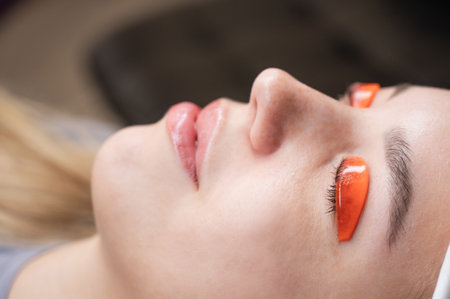Caucasian woman undergoing eyelash lamination procedureの写真素材